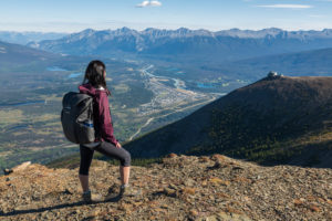 A woman standing on mountain peak