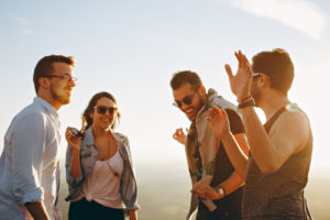 Group of people having fun together under the sun