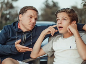 Man talking to a boy